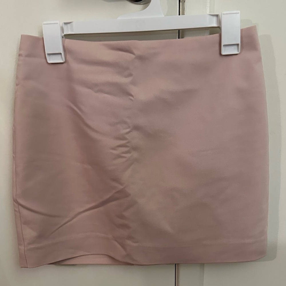 Pink mini skirt with zipper in back. Thick sturdy material.